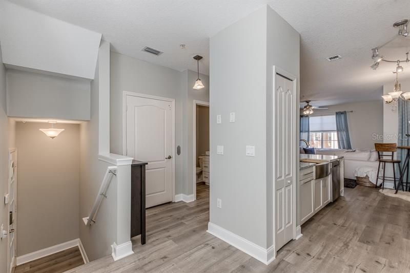 Main floor landing as you enter the dining room, foyer and open floor plan. (Formal dining currently being used a work from home office. )