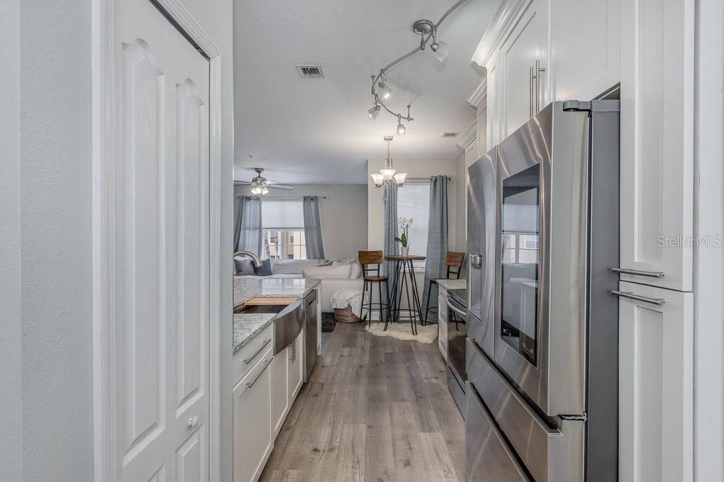 View of the kitchen, closet pantry to the left.