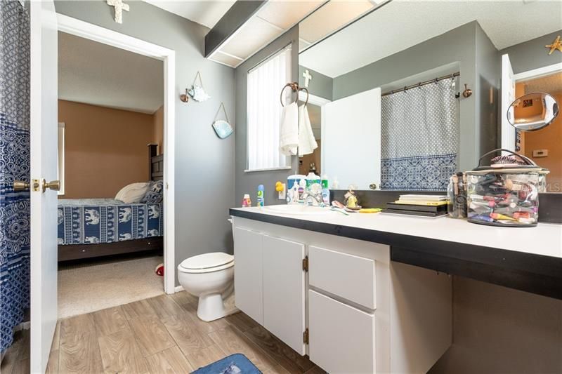 Large Master Bath w/ New Wood Look Tile Floor & double sink vanity