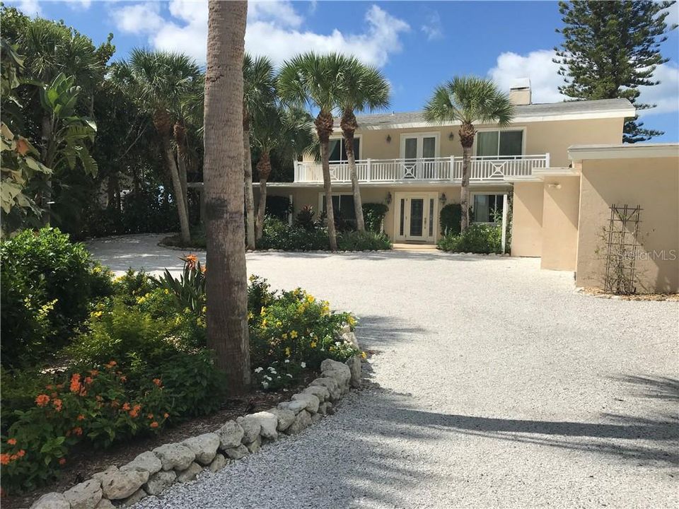 The circular shell driveway provides safe and easy access to the residence.