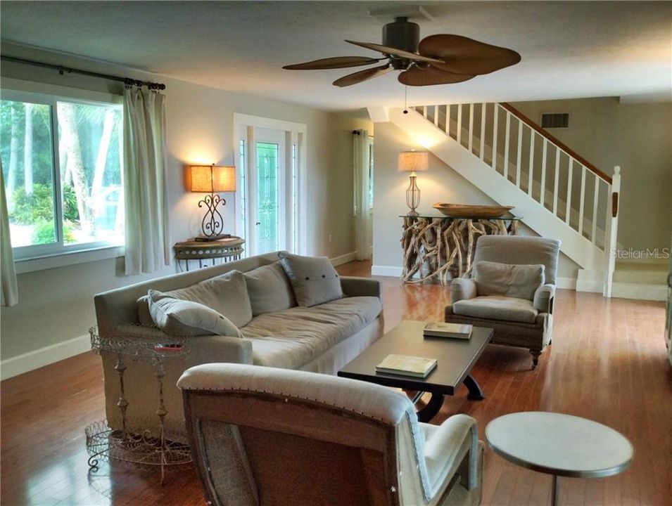 Comfortable living room.  Stairs lead to the second floor master ensuite and the guest double ensuite.