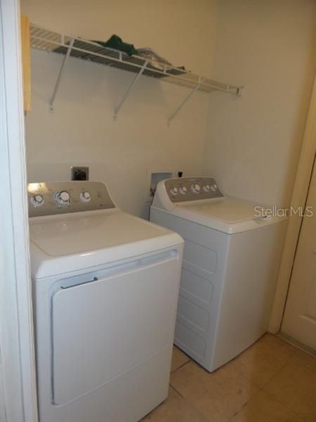 LAUNDRY ROOM WITH WASHER AND DRYER INCLUDED.