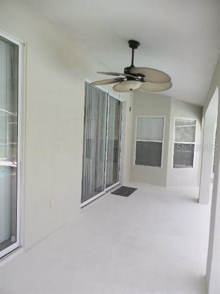 ENCLOSED PORCH WITH CEILING FAN AND PLENTY OF ROOM