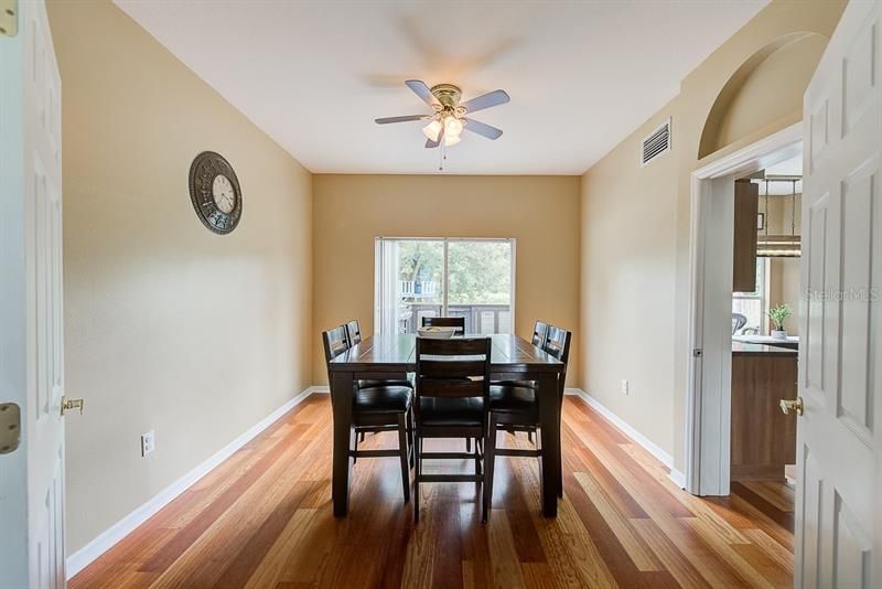 Formal dining room with views of the back yard and easy access to the kitchen