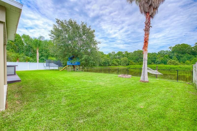 Mature landscaping and amazing pond and preserve views