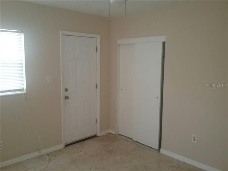 BEDROOM has back door opens to fenced in yard