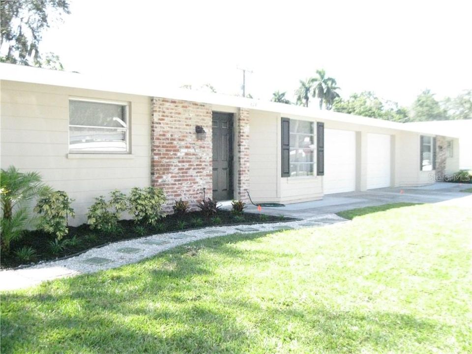 Attractive very clean exterior front (garage in middle).