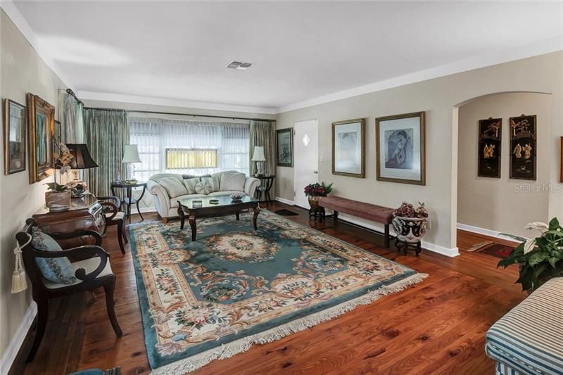 Large living / family room with natural wood floors
