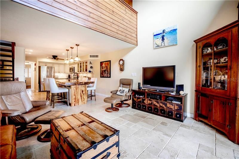 Living room is open to the kitchen and dining area-loft above