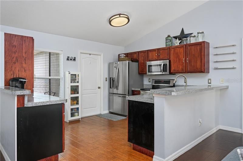Kitchen with breakfast bar and all stainless steel appliances included!
