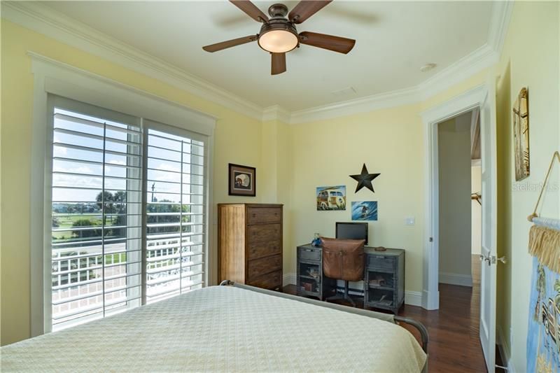 Elevator or stair access to upstairs bedroom #2.  Private balcony with golf view. Plantation shutters.