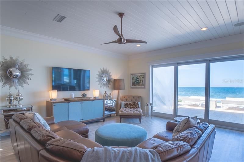 Sophisticated yet relaxed interior of the family room with pocket sliding high impact doors- open for an instant ocean breeze.