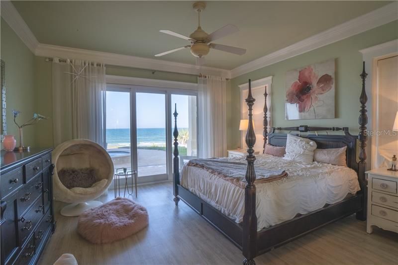 Downstairs bedroom (could be used as second master) with pool and ocean view 24/7!  High impact sliders open for instant ocean breeze.  Bedroom suite has a full walk in closet and spa bathroom.