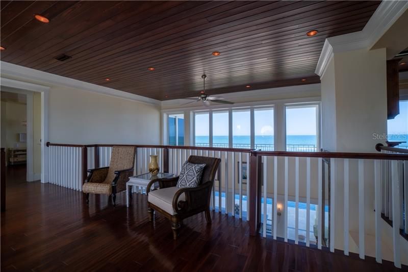 Elevator or stair access to Upstairs loft with West indies inspired design, rich wood floors and ceilings, open air, panoramic ocean views.