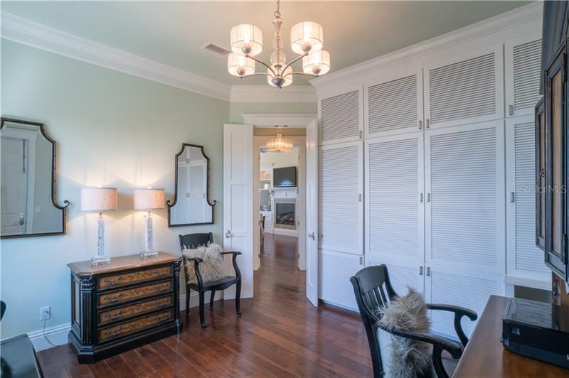 Elevator or stair access to the Master Suite.  Private master office with floor to ceiling built storage built-ins.  Private exit to the outside or enter through master suite.  Side ocean view.