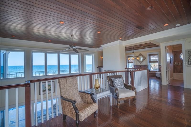Elevator or stair access to open air loft with West indies inspired design, rich wood floors and ceilings, panoramic ocean views.