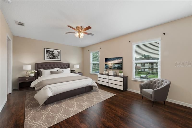 PRIMARY SUITE features beautiful WOOD LAMINATE FLOORS! Virtually Staged.