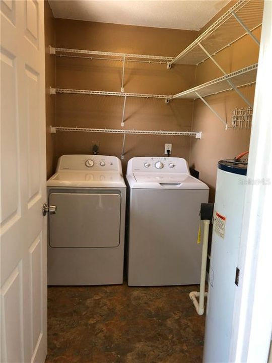 Inside laundry with lots of storage.