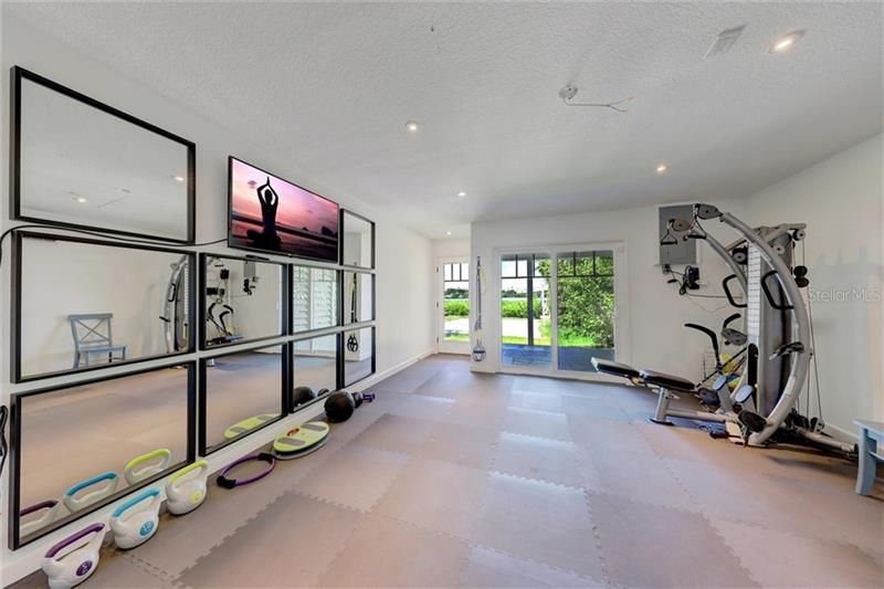 Located below the guest apartment and steps away from the sand volley ball court, you will find your private fitness room!