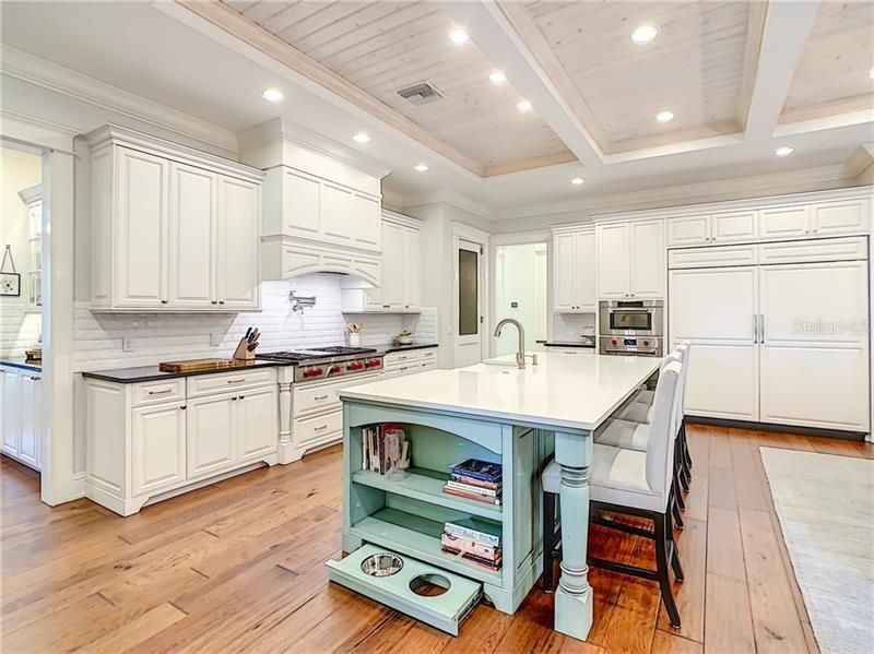 NO DETAIL HAS BEEN OVERLOOKED IN THIS CUSTOM KITCHEN, EVEN THE PETS HAVE A PLACE TO EAT IN THE KITCHEN....