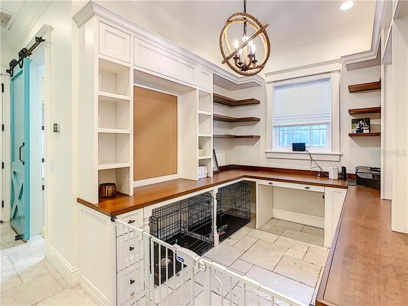 ANOTHER VIEW OF THE OFFICE/PET STATION WHICH IS LOCATED NEXT TO THE LAUNDRY ROOM WITH PET WASHING STATION AND A BEAUTIFUL CUSTOM BARN DOOR...