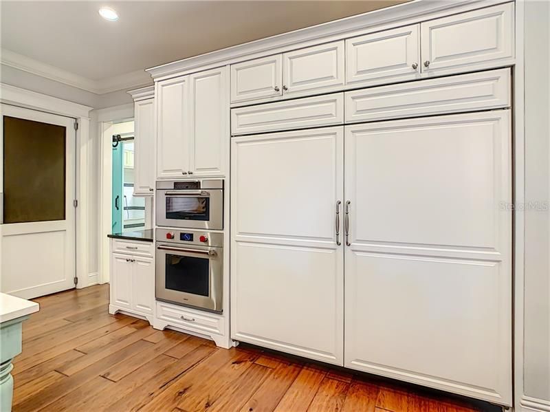 HUGE SUBZERO REFRIGERATOR/FREEZER, WOLFE OVEN AND STEAMER, LOOK AT THE BEAUTIFUL CUSTOM WOOD CABINETS.