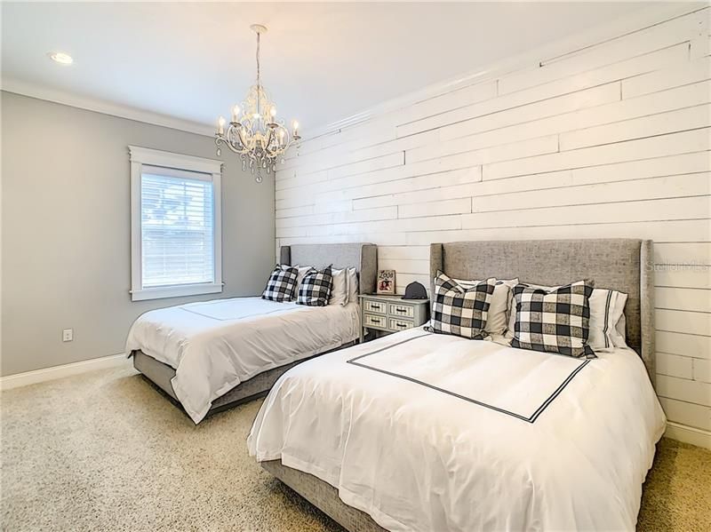 ADDITONAL VIEW OF THE 2ND UPSTAIRS BEDROOMS.. WHITE WOODEN WALL IN THIS OVERSIZED BEDROOMS.. ALL HAVE WALKIN CLOSETS.