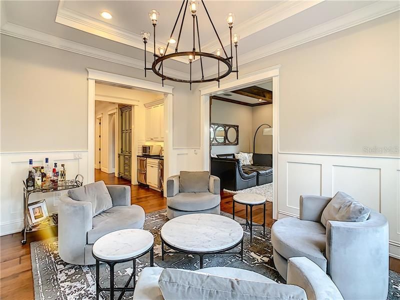 SITTING AREA OFF THE BAR AREA. NOTICE THE MILLWORK, TRAY CEILINGS AND CUSTOM LIGHTING.