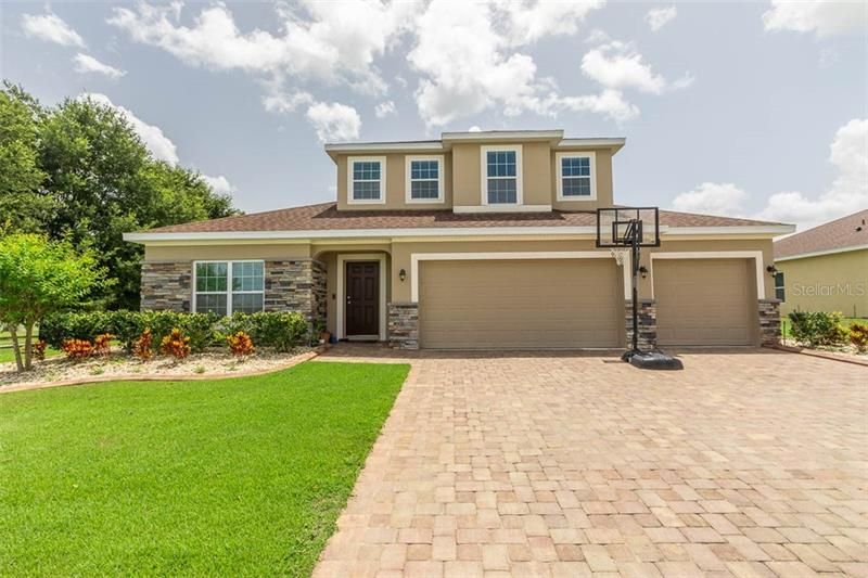 Exterior Front view with paver driveway