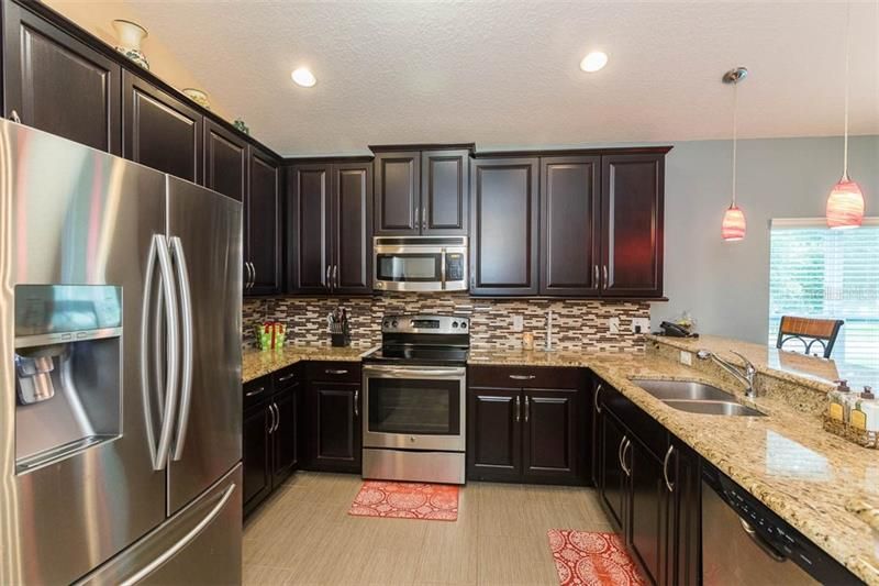 Kitchen with Stainsless Steel appliances and recessed lighting