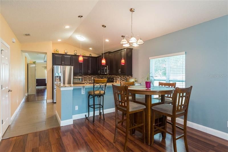 Kitchen with breakfast bar and dinette area