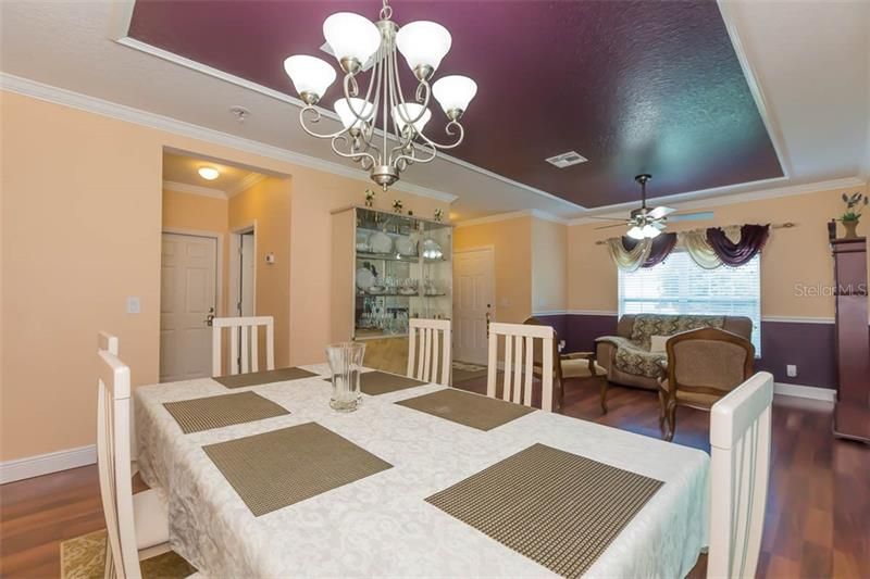 Formal dining room near garage entry and laundry room