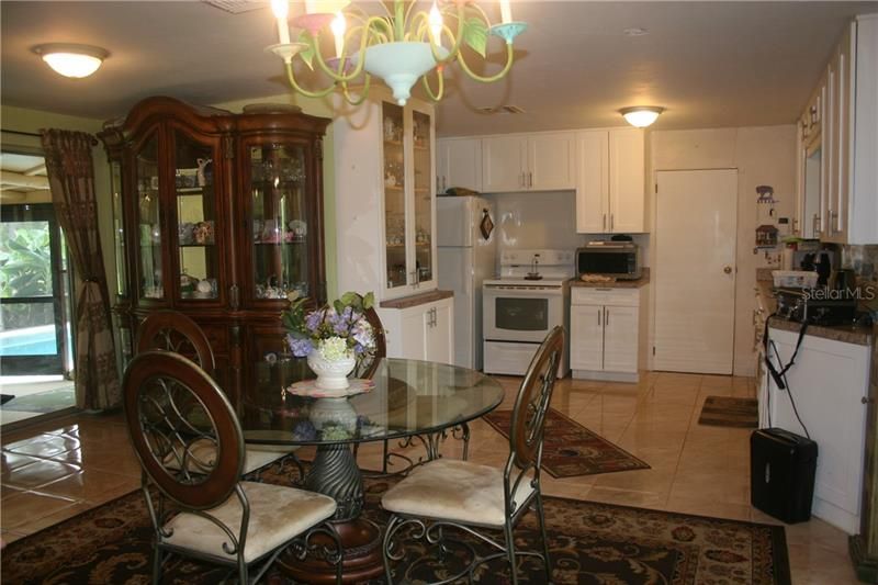 Dining Area with Hutch and Kitchen.