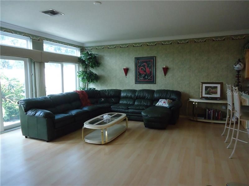 Living room is large with plenty of room for large sofa.
