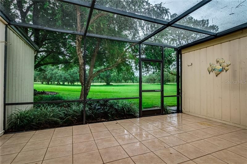 tiled covered lanai and porch with beautiful golf course views