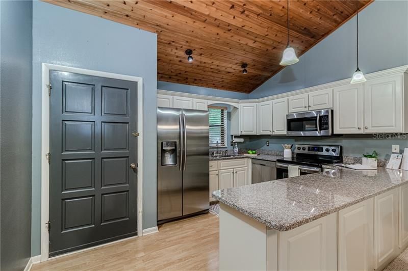 Kitchen with granite counters and stainless appliances