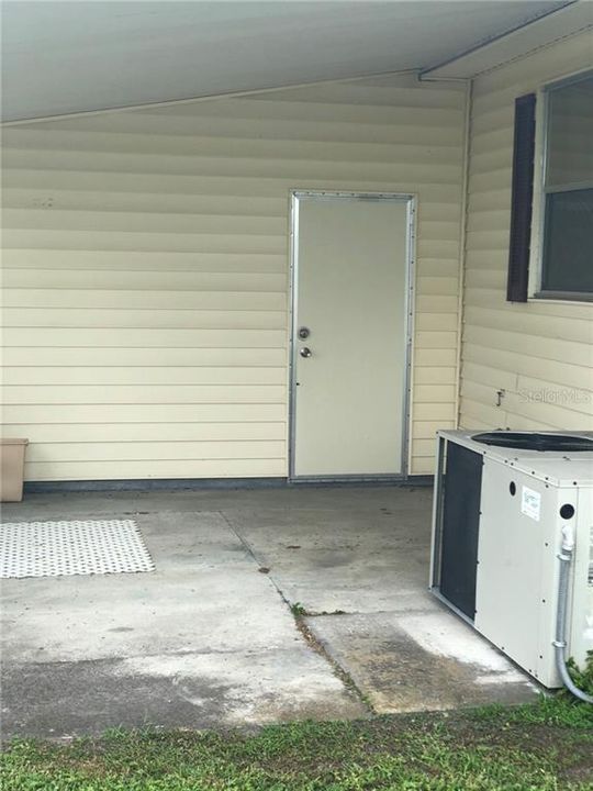 Golf Cart Parking Pad in Backyard w/Garage Entrance Door