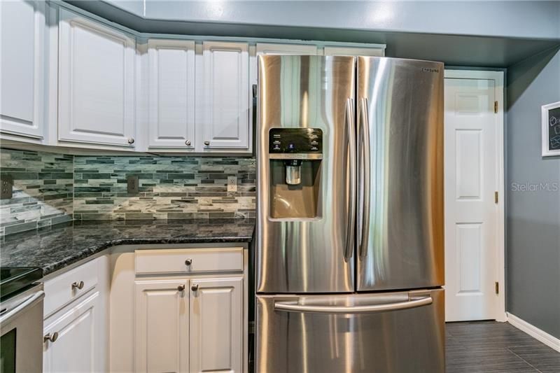 Granite Countertops and All Glass Backsplash!