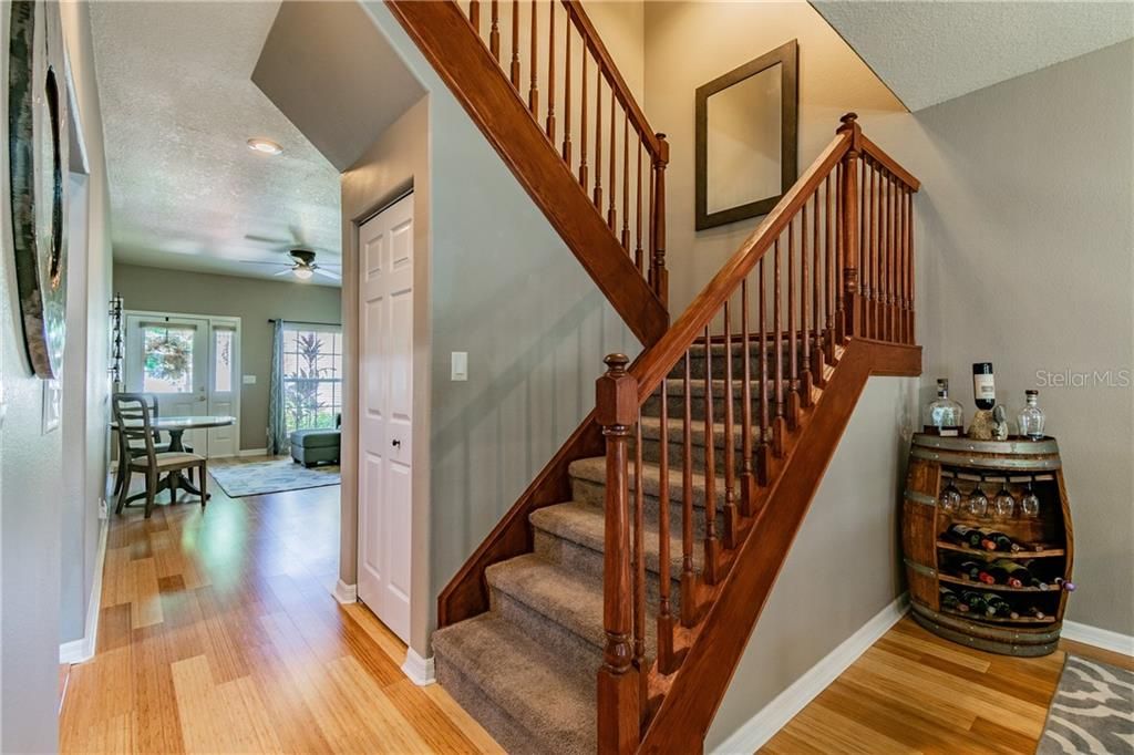 Carpeted Staircase with Wood Railing!