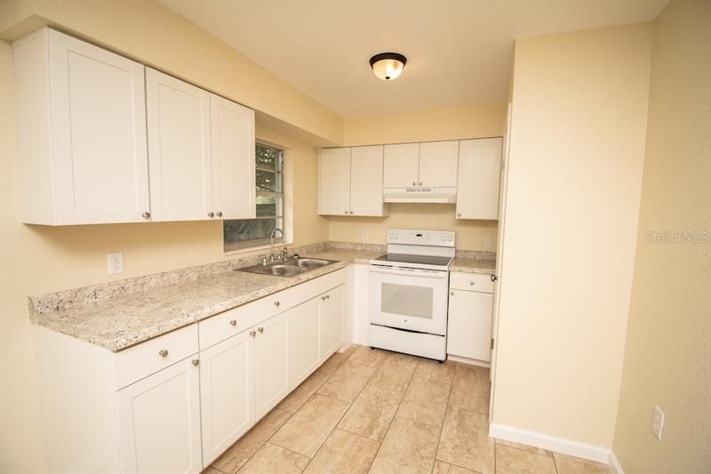 Kitchen with upgraded cabinets, countertops and appliances