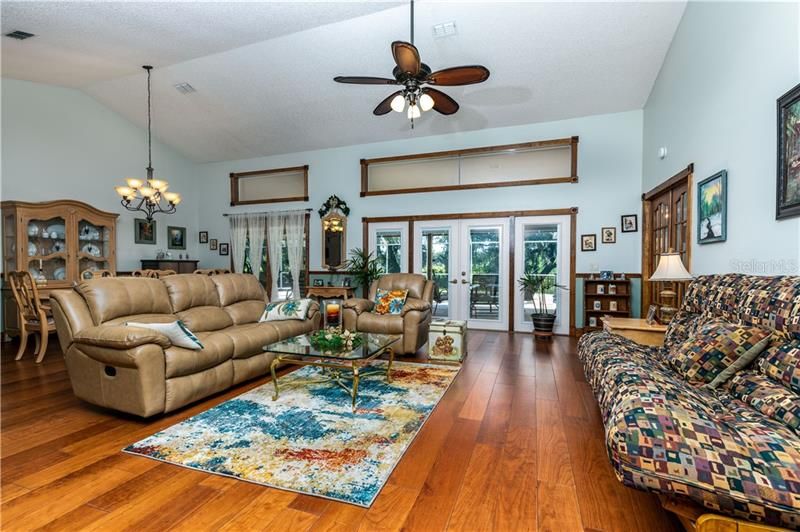 Formal living or family room with view of the pool, lakeside