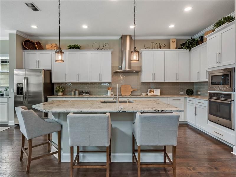This gourmet kitchen is complete with Large Island, tons of cabinetry and built in microwave and oven.