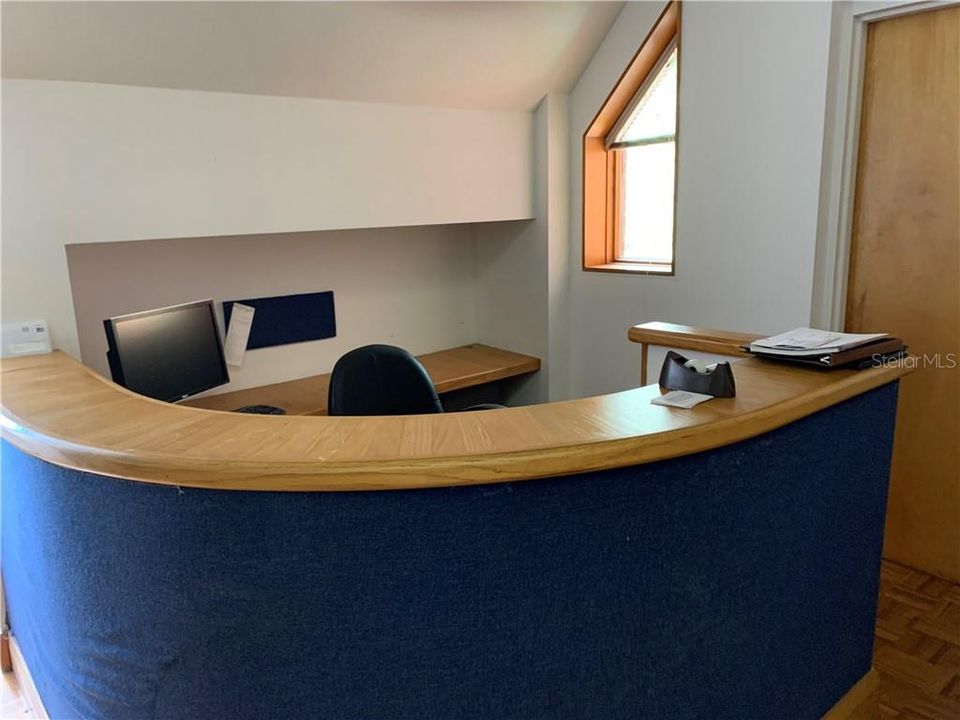 Starting at the entrance to the third floor you find a fully outfitted space beginning with the reception desk.