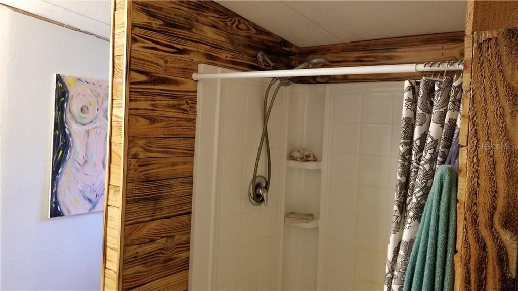 Master shower with custom woodwork
