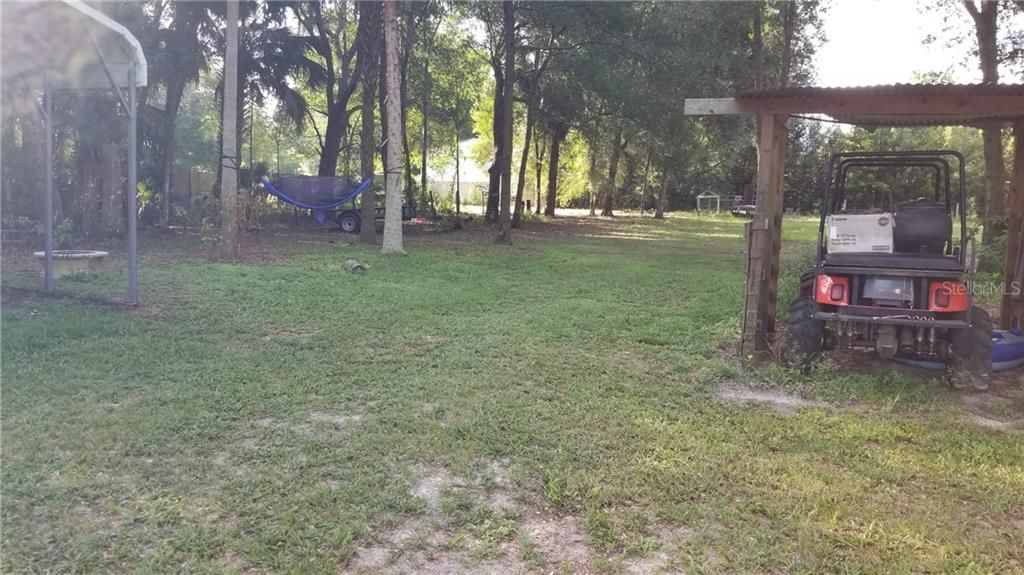 Back yard, left side,  carport does not convey