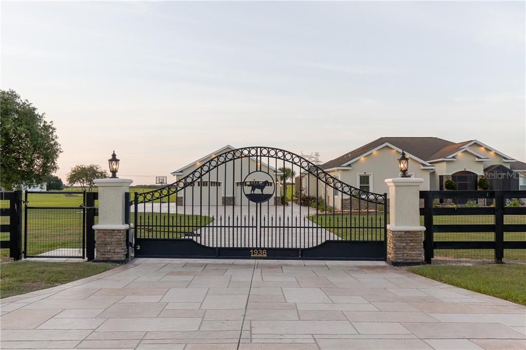 Gorgeous wrought iron gate at entrance of estate