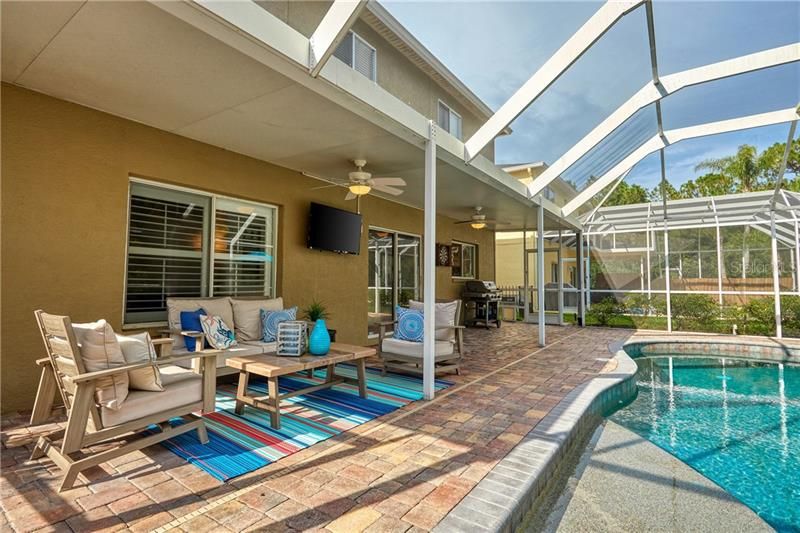 Enjoy FULL SUN with this north-facing home while staying COOL on the large COVERED LANAI with COOLING FANS!!!