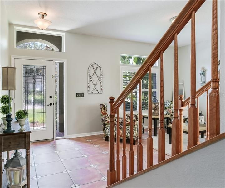 The WELCOMING entrance showcases gorgeous European inspired Terracotta flooring & a beautiful staircase with Stylish Spindles, adding instant STYLE & WARMTH!!