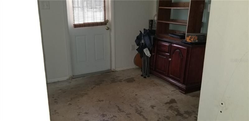 room could be used for dining or study. It needs flooring. It is between 3rd bedroom and laundry