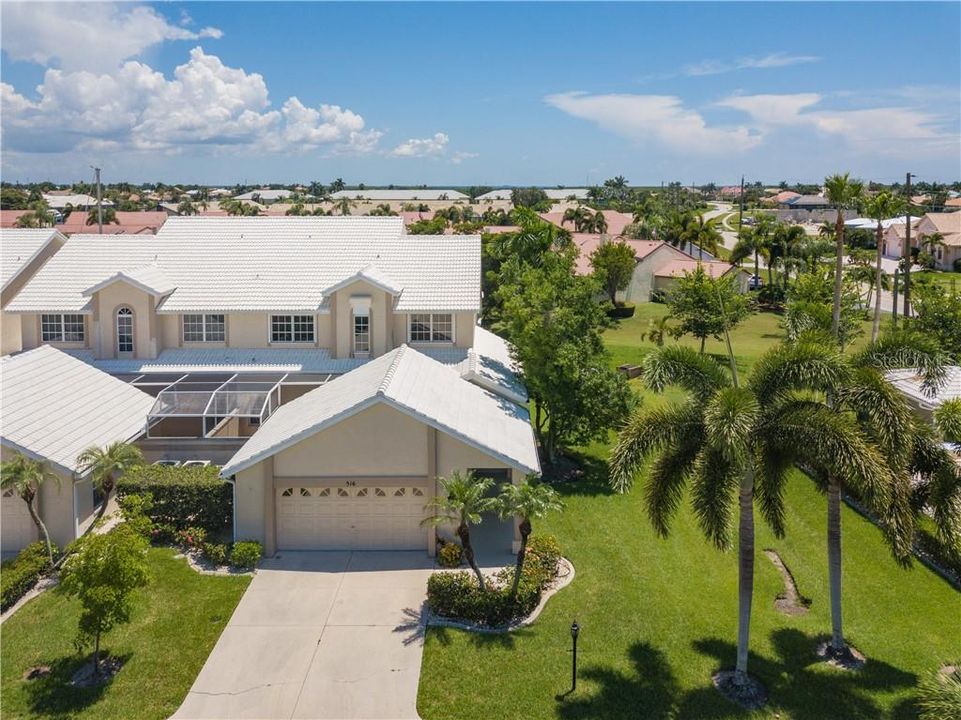 PUNTA GORDA ISLES! QUICK SAILBOAT ACCESS TO CHARLOTTE HARBOR LEADING TO THE GULF OF MEXICO VIA BUCKLEYS PASS! Spacious 3 bd, 2.5 ba, 2-car garage END UNIT waterfront townhome in Harbor Landing with deeded dock!